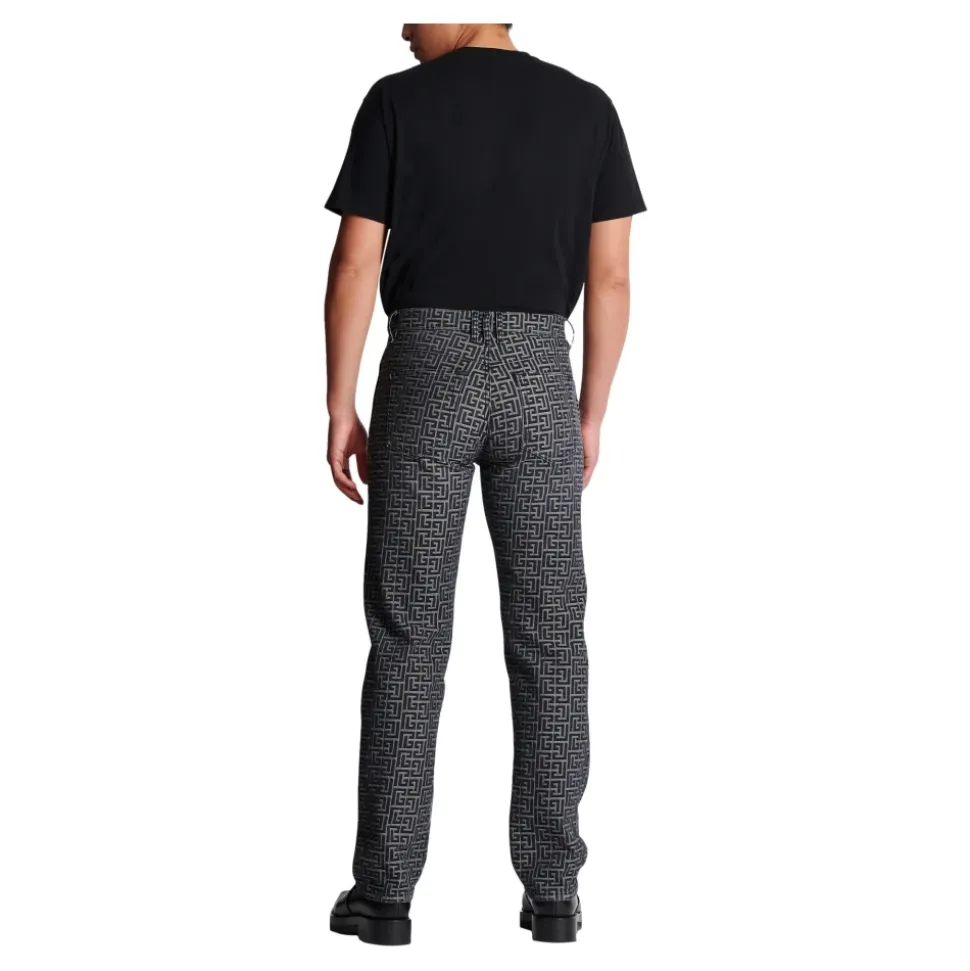 Jeans in denim jacquard con monogramma