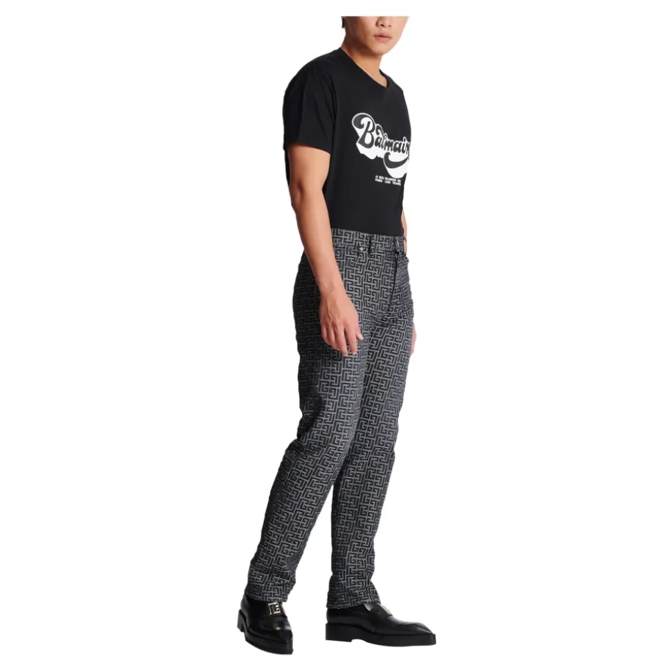 Jeans in denim jacquard con monogramma
