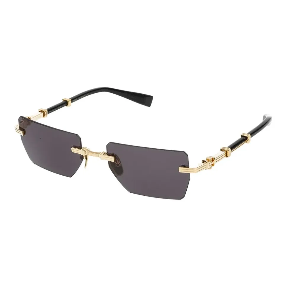 Occhiali da sole eleganti in oro e nero